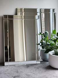 Contemporary frameless centre glass mirror