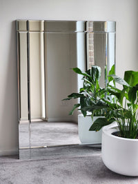 Contemporary frameless centre glass mirror