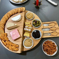 Round wooden chopping board and cutlery set